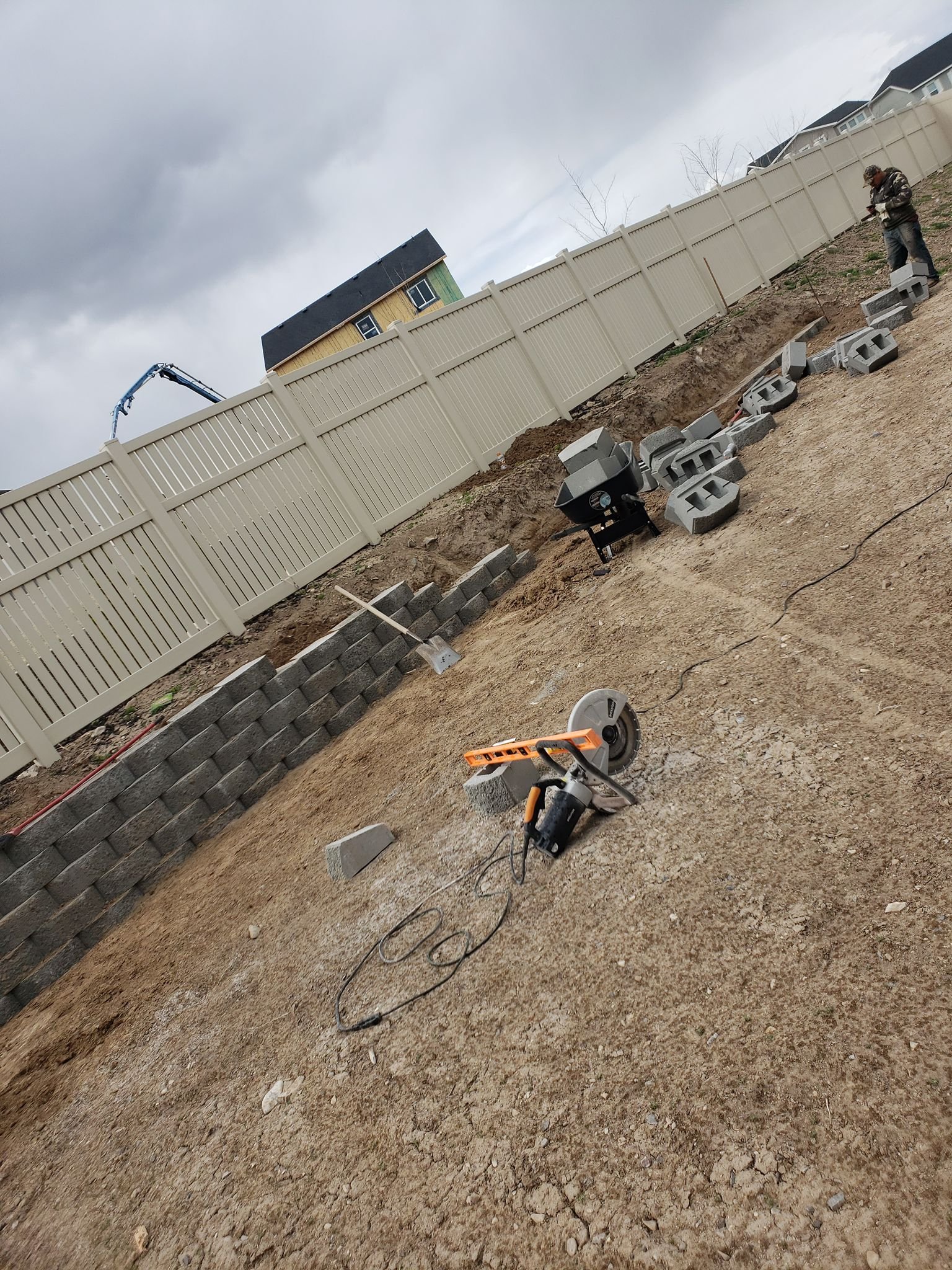 Patino Landscaping Utah retaining wall in process backyard